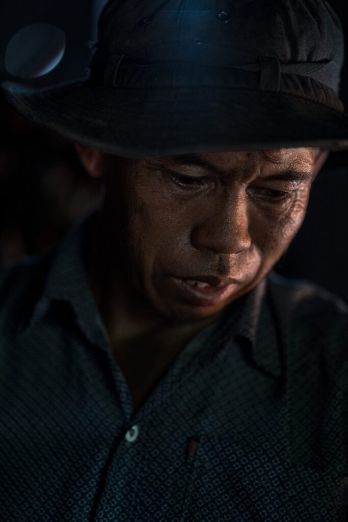 Pov Working in his Fish Smokehouse, Kompong Khleang, Cambodia