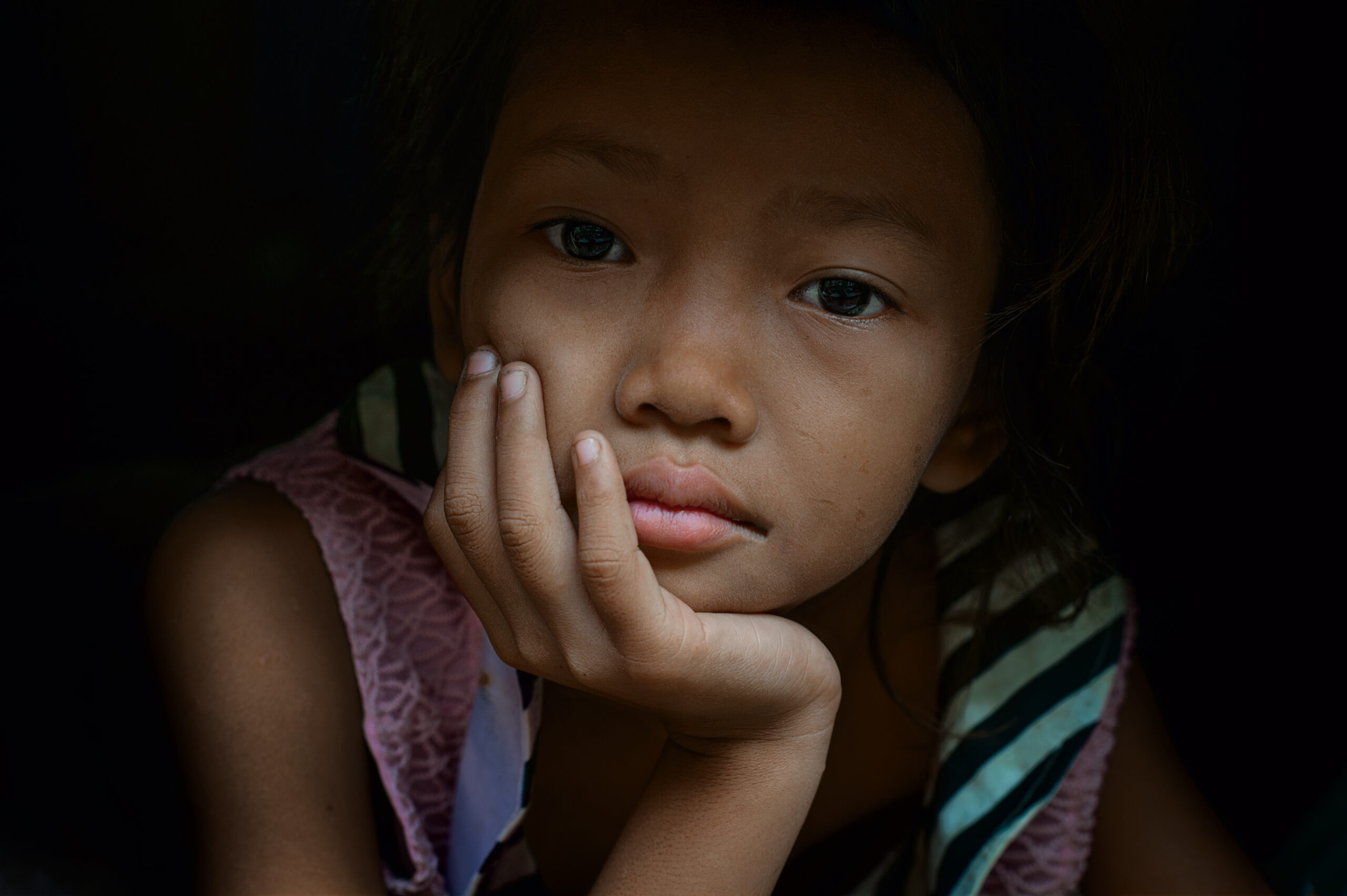 Srey Pich staring out her window II